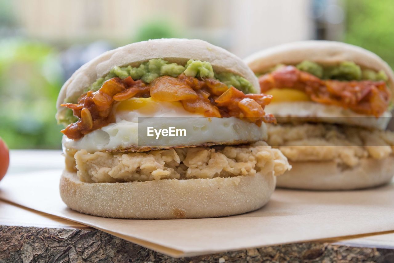 Close-up of burgers on table