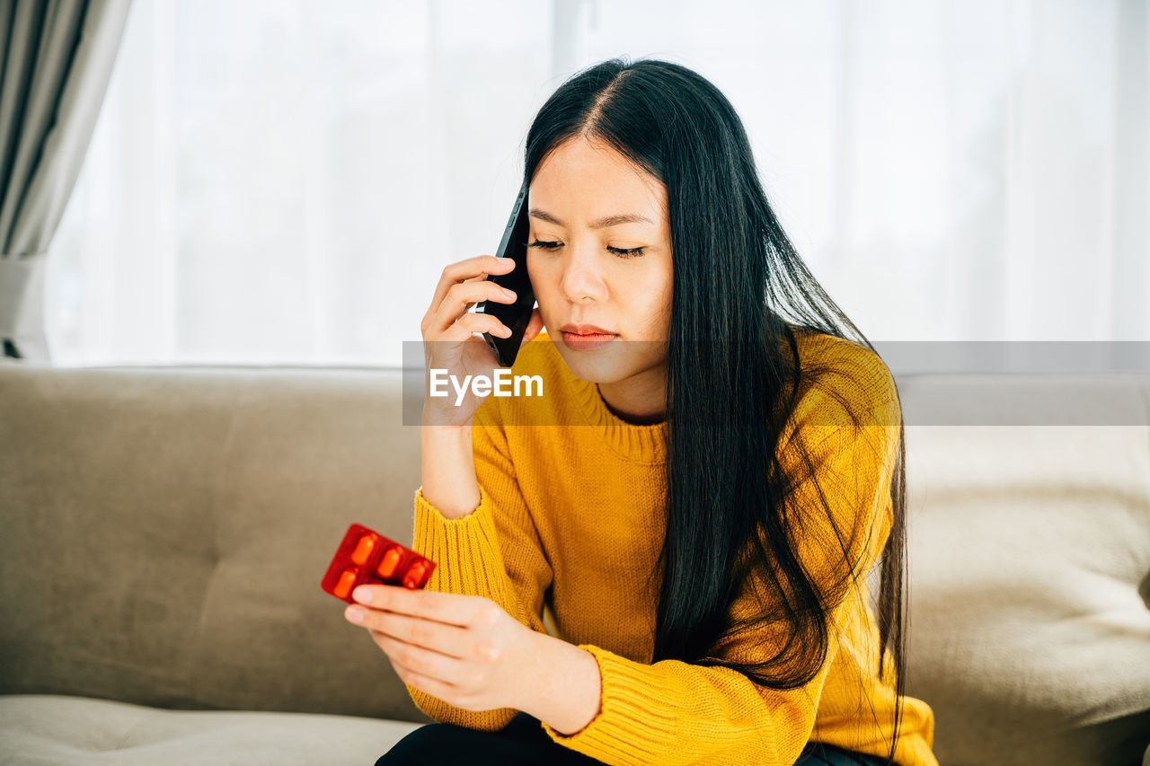 young woman using phone