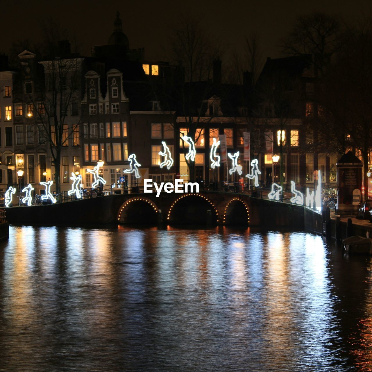 VIEW OF ILLUMINATED BUILDINGS AT NIGHT