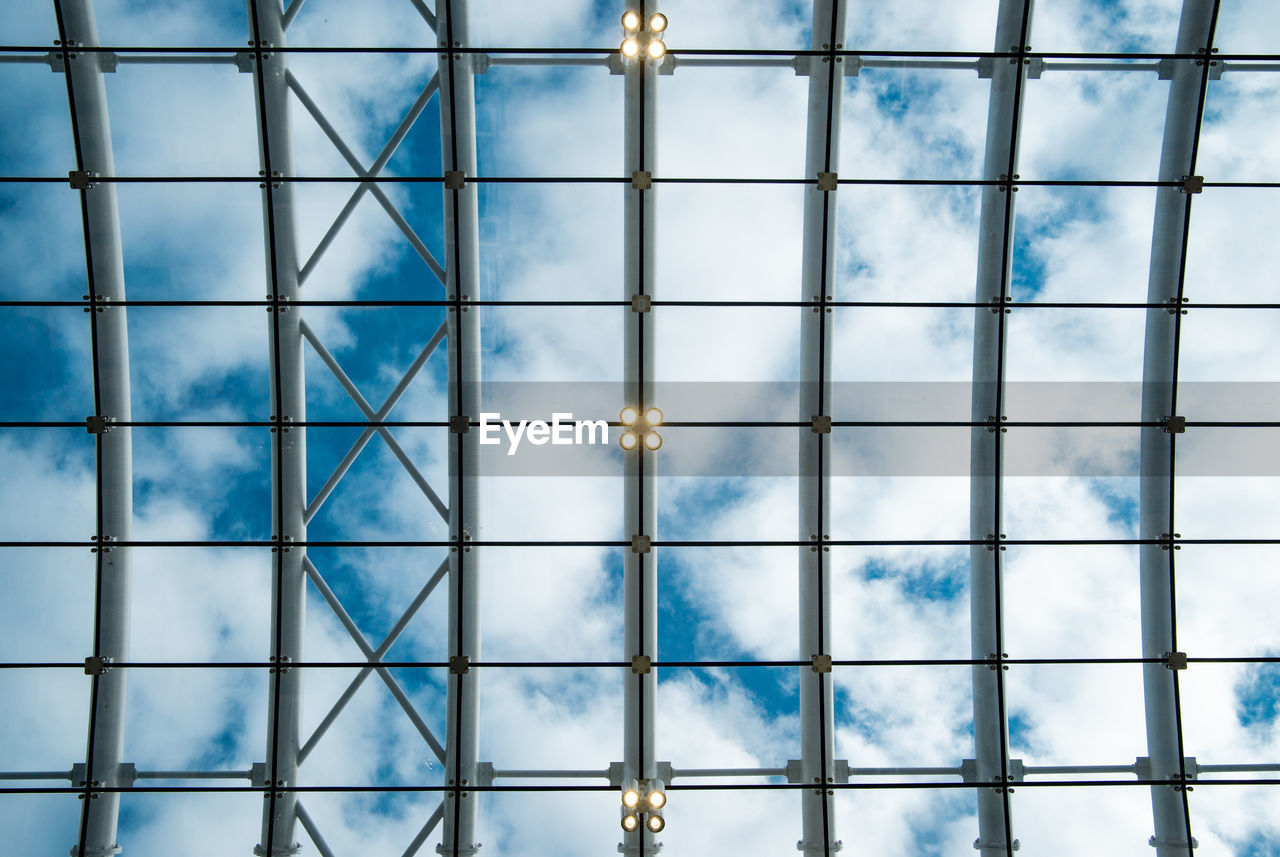 Full frame shot of glass window against blue sky