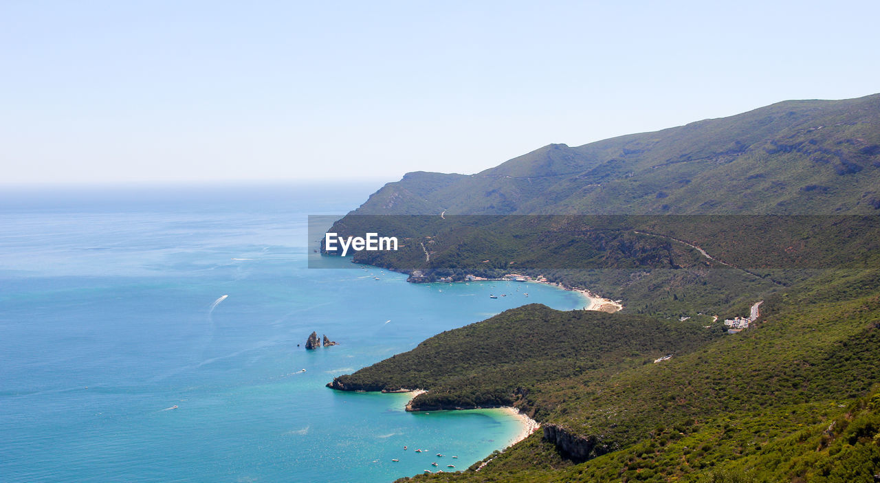 Scenic view of sea against clear sky