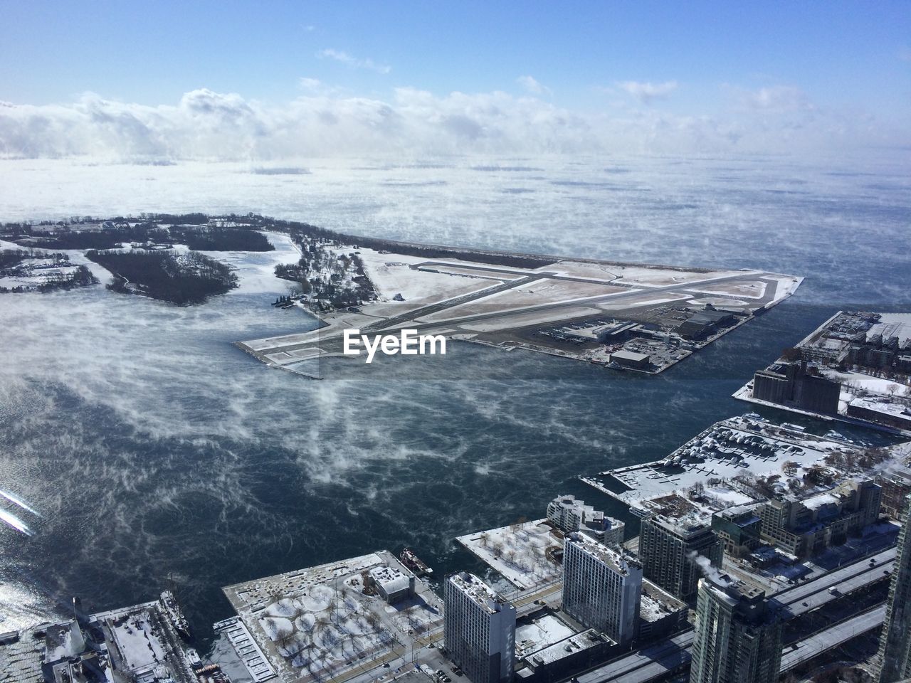 Aerial view of billy bishop toronto city airport against sky