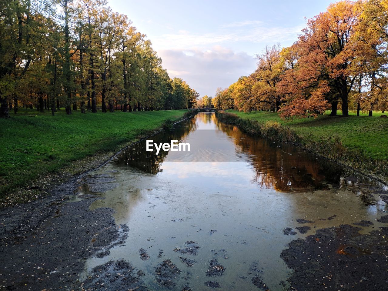 SCENIC VIEW OF CANAL AGAINST SKY DURING AUTUMN