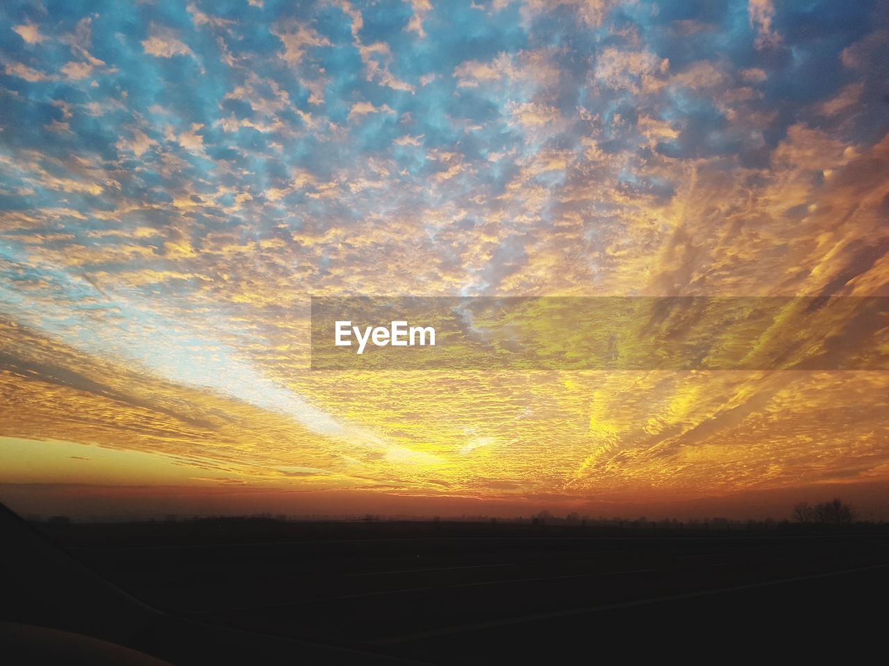 SCENIC VIEW OF SILHOUETTE LANDSCAPE AGAINST SUNSET SKY