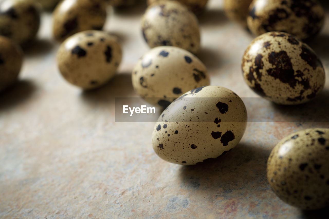 Quail eggs on a stone table.