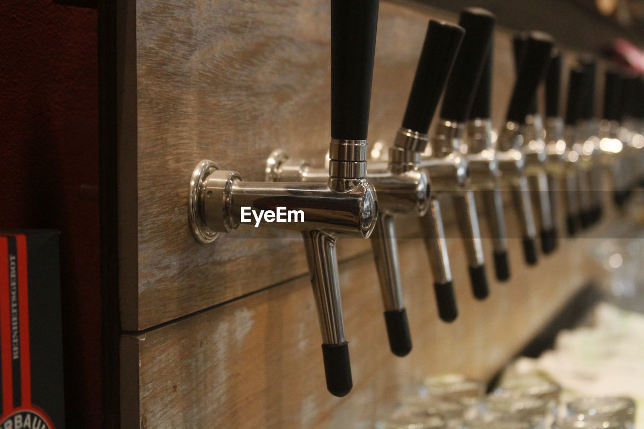 Row of beer taps at microbrewery