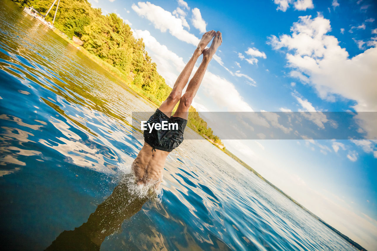Man in handstand in water