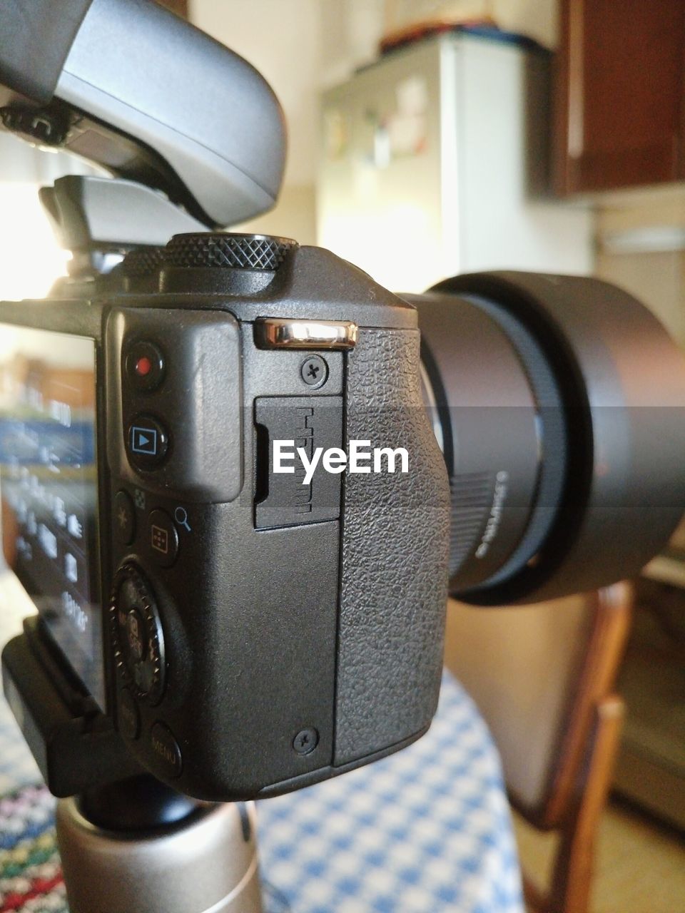 CLOSE-UP OF CAMERA AND KEYBOARD