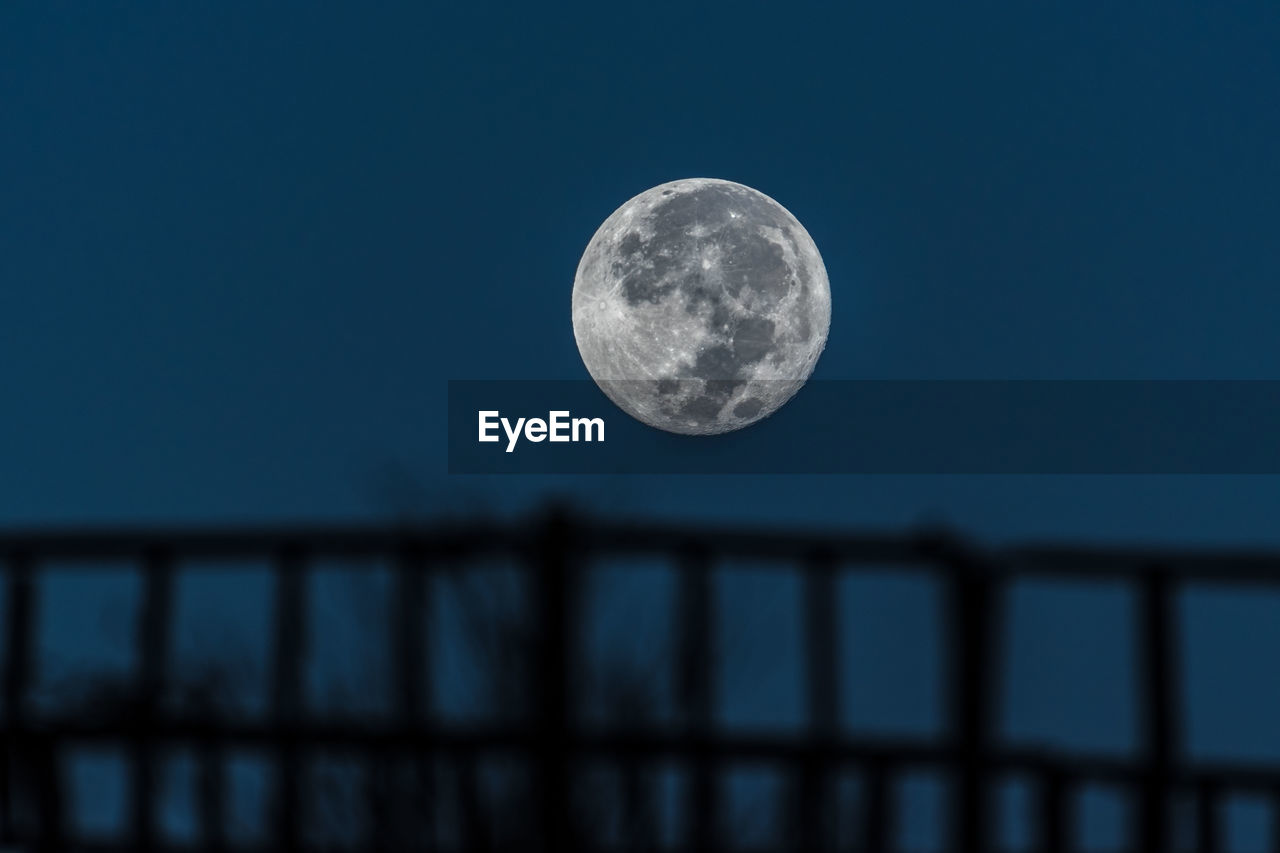 Low angle view of moon against sky at night