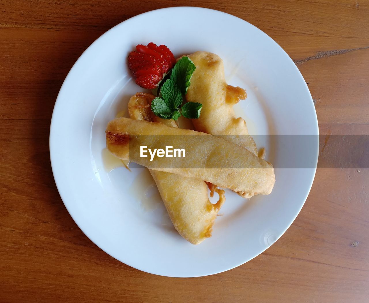 food and drink, food, dish, freshness, plate, healthy eating, fruit, table, meal, breakfast, fast food, no people, sweet food, wellbeing, indoors, wood, produce, directly above, high angle view, dessert, still life, cuisine, sweet, serving size, berry, strawberry, close-up, snack, baked