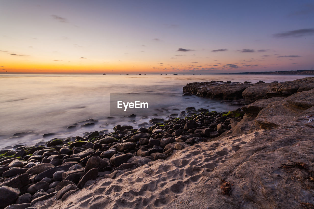 Scenic view of sea against sky during sunset