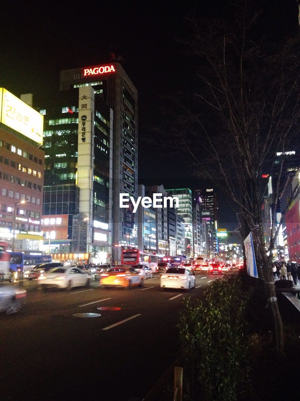 VIEW OF CITY STREET AT NIGHT