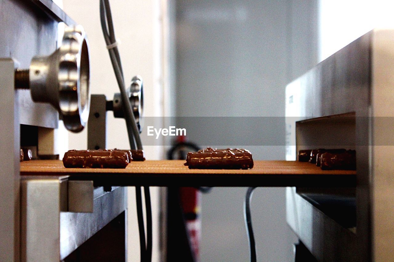 Chocolates on conveyor belt in factory
