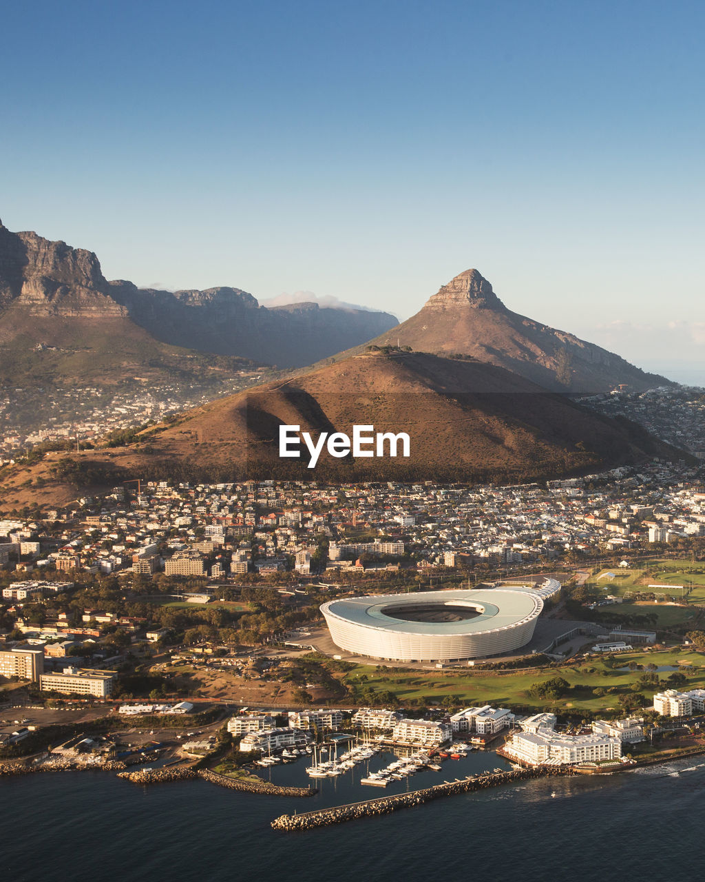 High angle shot of town against mountains