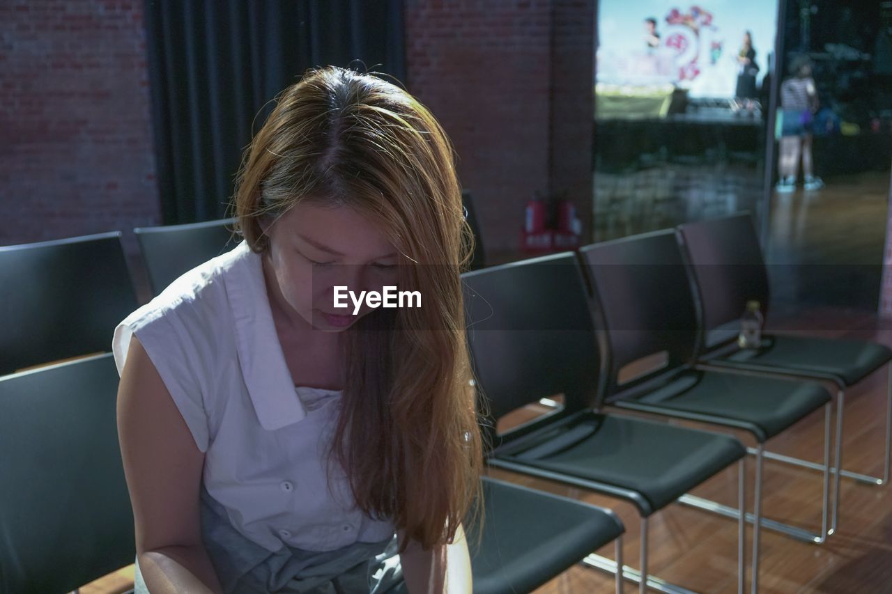 Woman sitting on chair