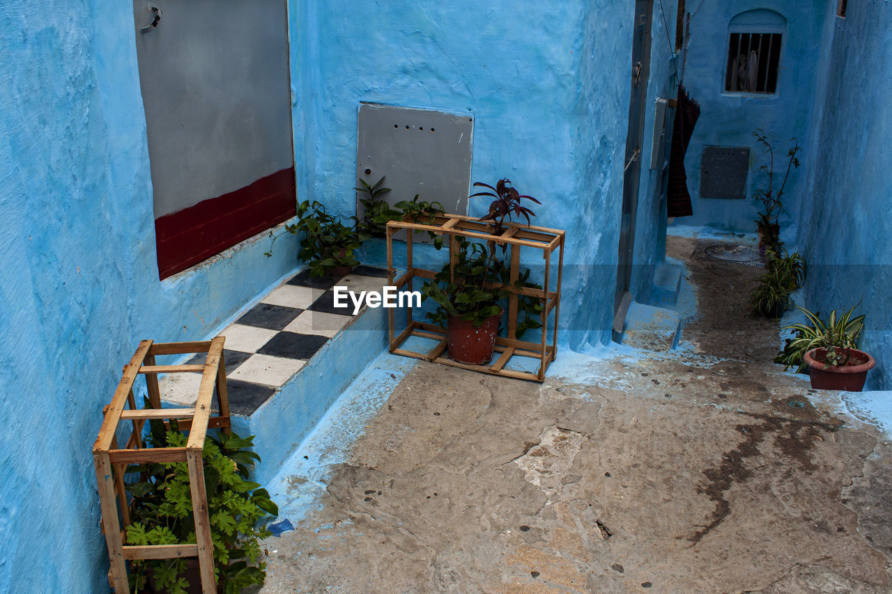 Historical tiny street, indigo blue houses in the old medina jewish quarter. fez,  morocco, africa.