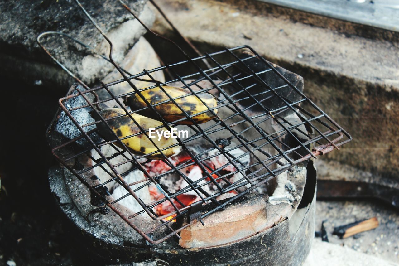 High angle view of bananas on old grill