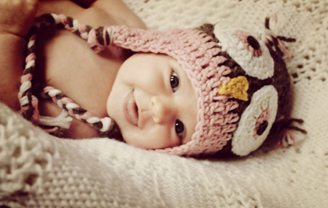 CLOSE-UP PORTRAIT OF CUTE BABY GIRL WITH SNOW