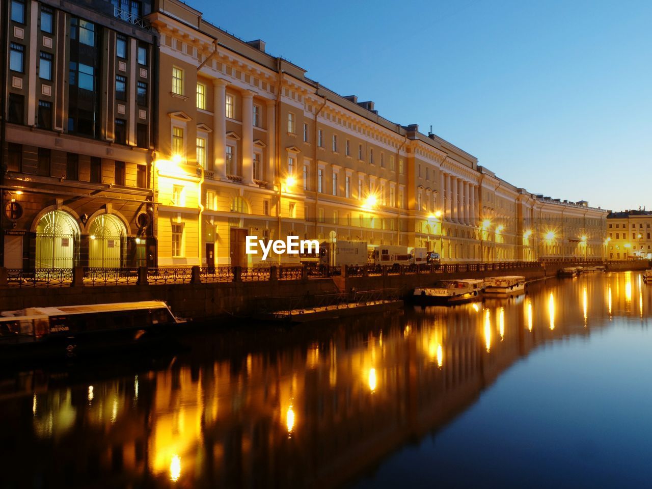 REFLECTION OF ILLUMINATED BUILDINGS IN WATER