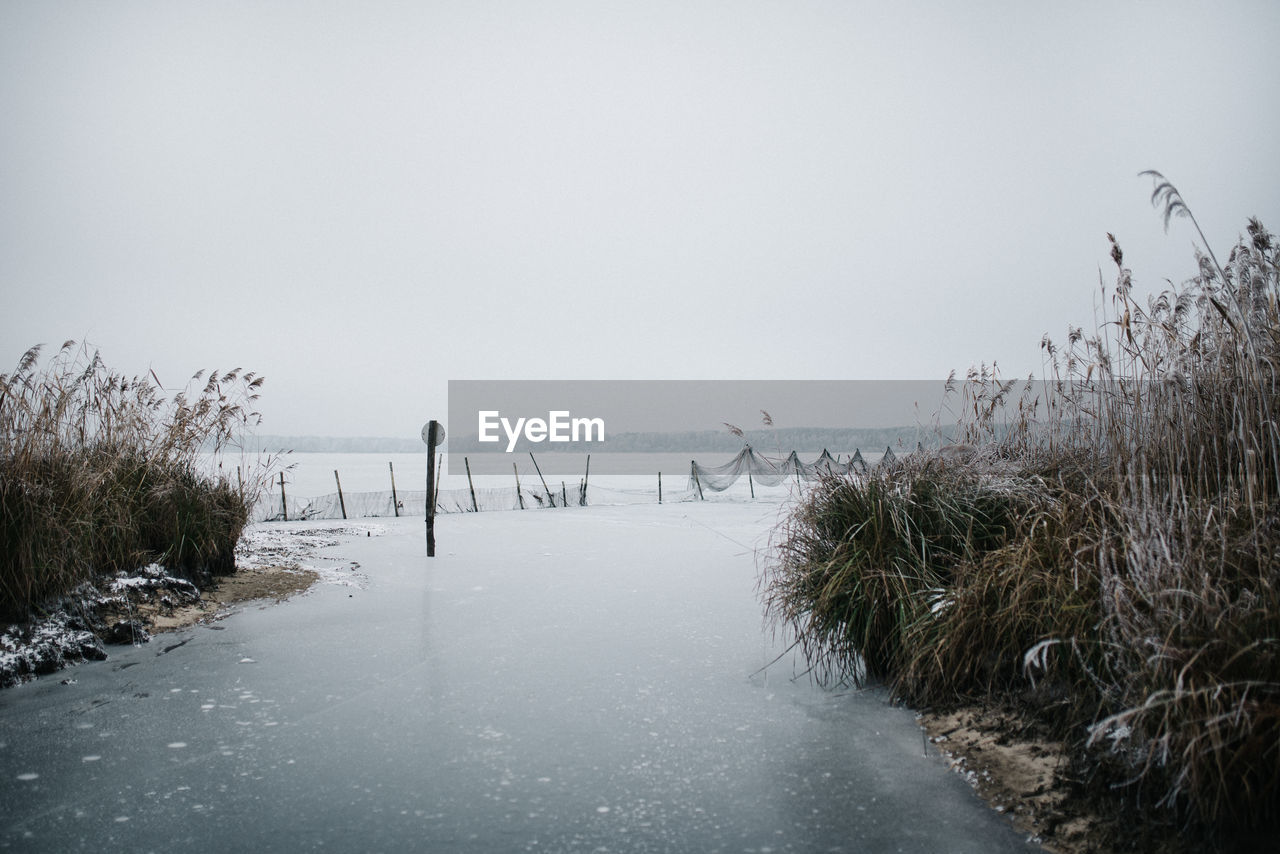 Scenic view of a frozen lake against clear sky