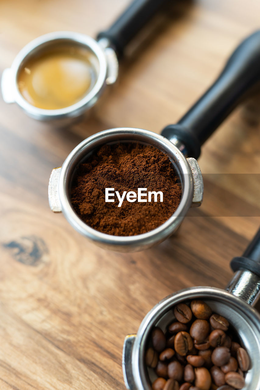 Different processes of preparing coffee by a barista in a coffee shop. coffee beans, ground, ready