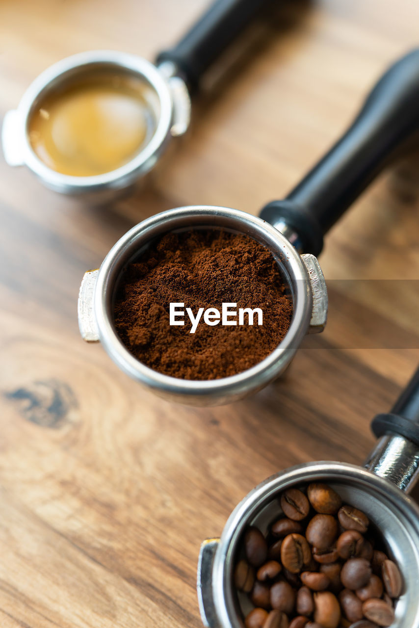 Different processes of preparing coffee by a barista in a coffee shop. coffee beans, ground, ready