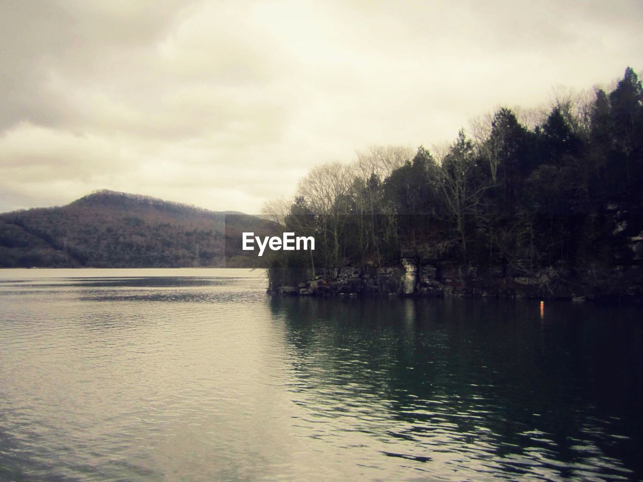 SCENIC VIEW OF LAKE WITH MOUNTAINS IN BACKGROUND