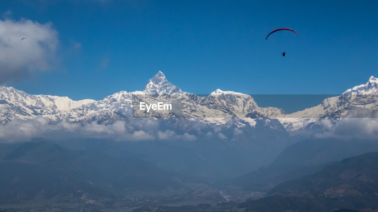 Paragliding over himalaya mountains, pokhara nepal