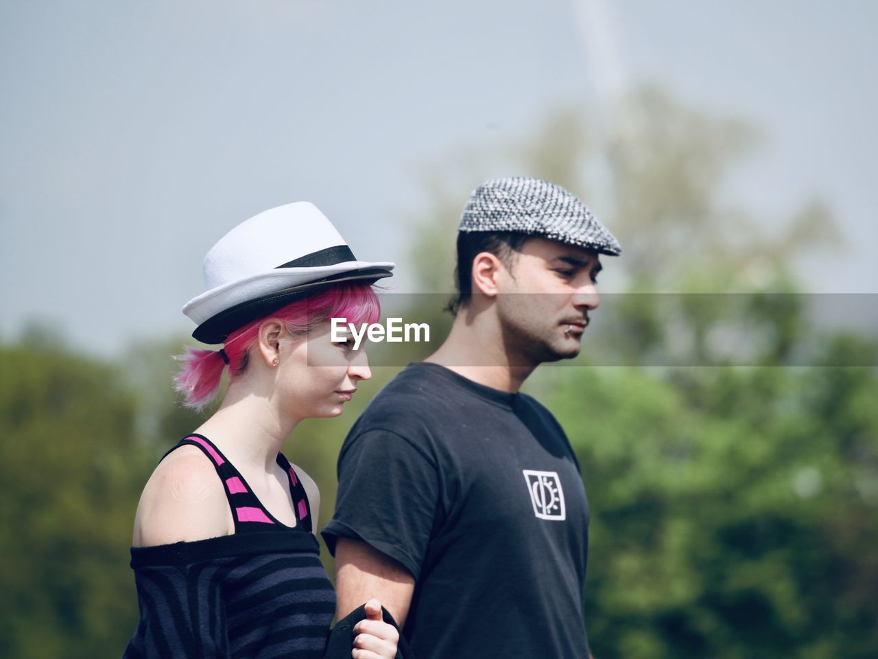 YOUNG MAN LOOKING AWAY IN HAT