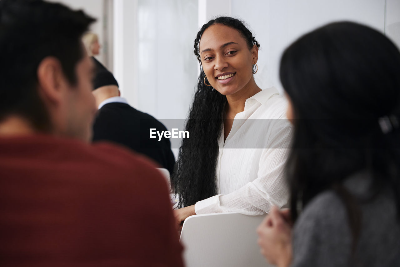 Smiling woman sitting at workshop