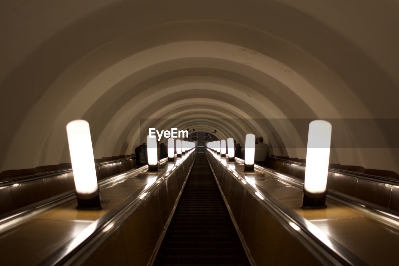 View of escalator in tunnel of metro