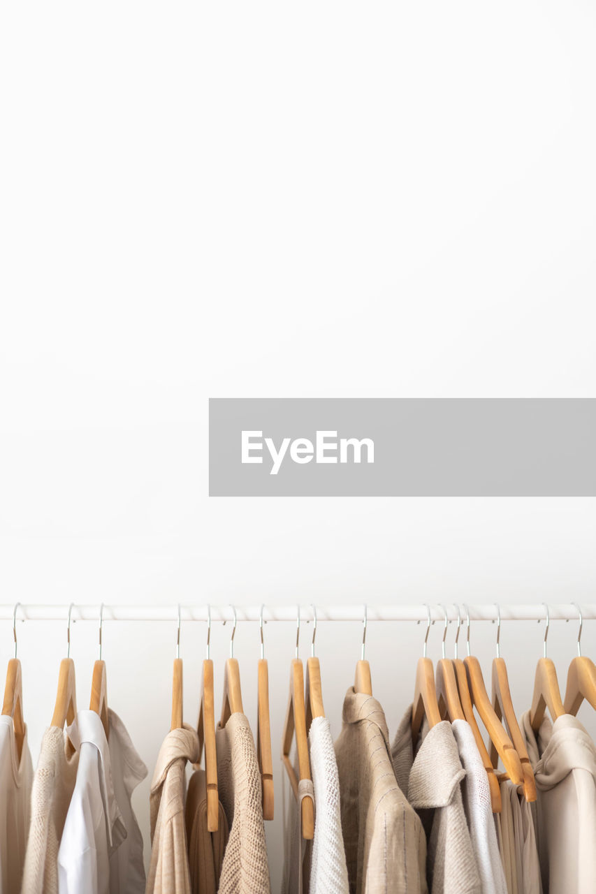 low angle view of clothes hanging against white background