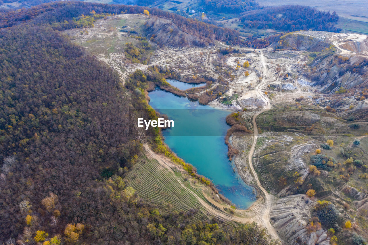 Drone view of industrial opencast mine filled with water. aerial shot of artificial lake