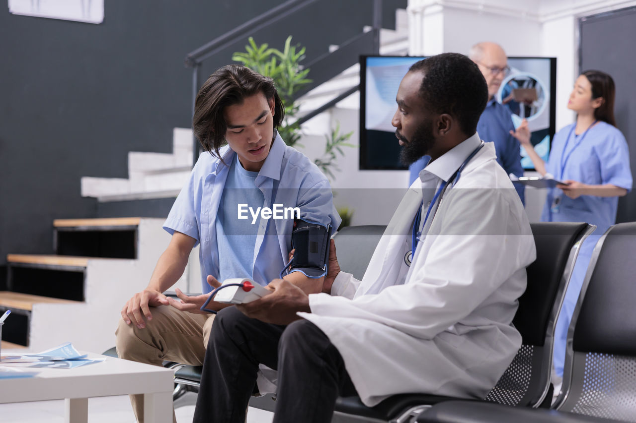 doctor explaining to patient at clinic