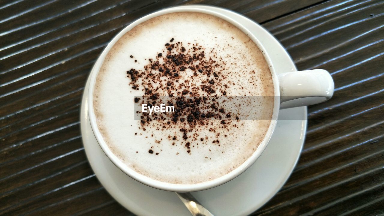 CLOSE-UP OF COFFEE CUP ON TABLE