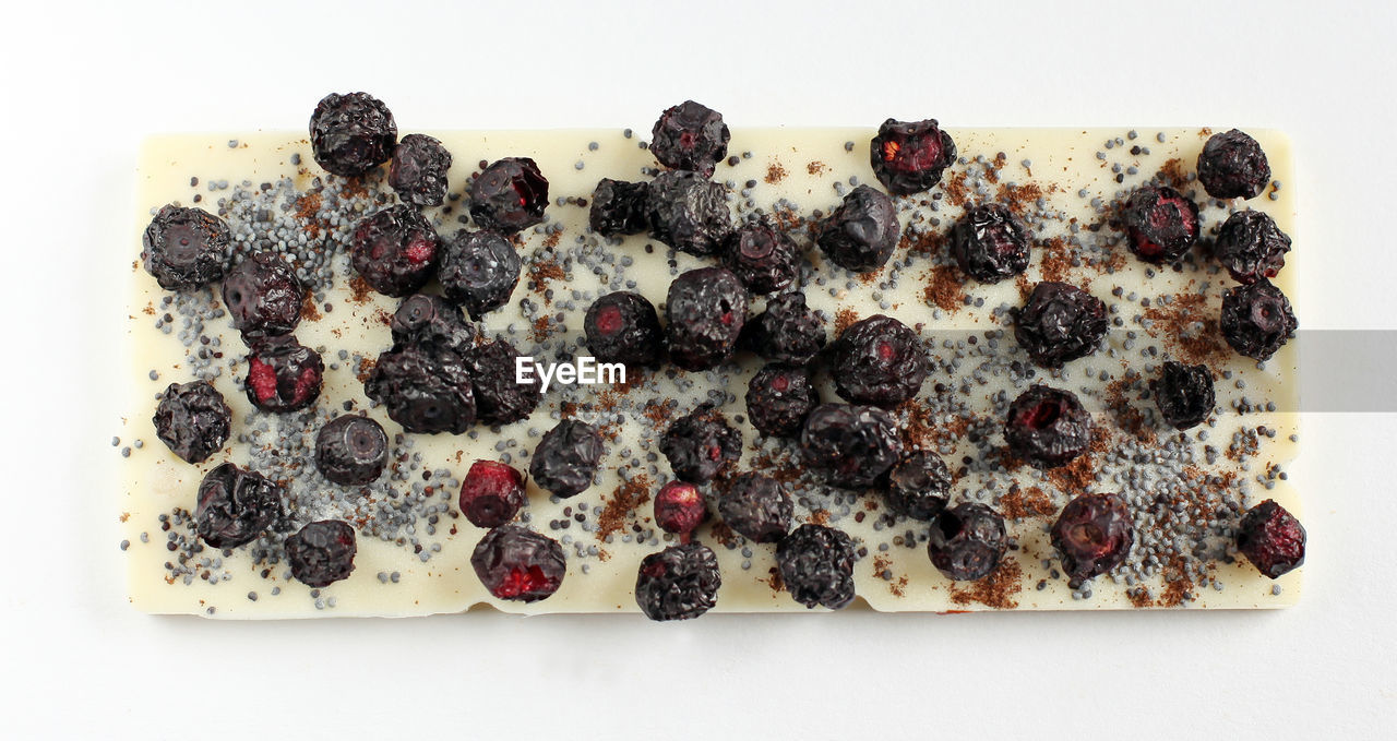 High angle view of handmade chocolates on white background