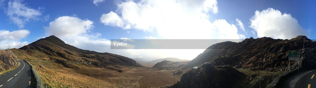 Panoramic view of landscape against cloudy sky