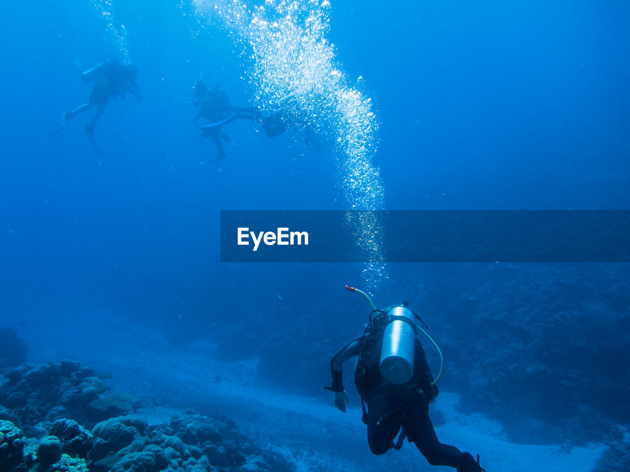 PEOPLE SWIMMING UNDERWATER