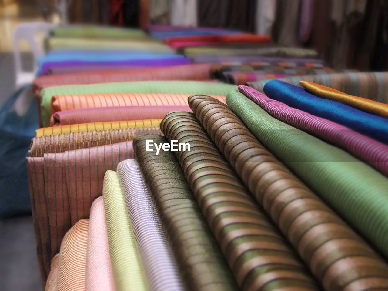 Close-up of stacked textiles in store