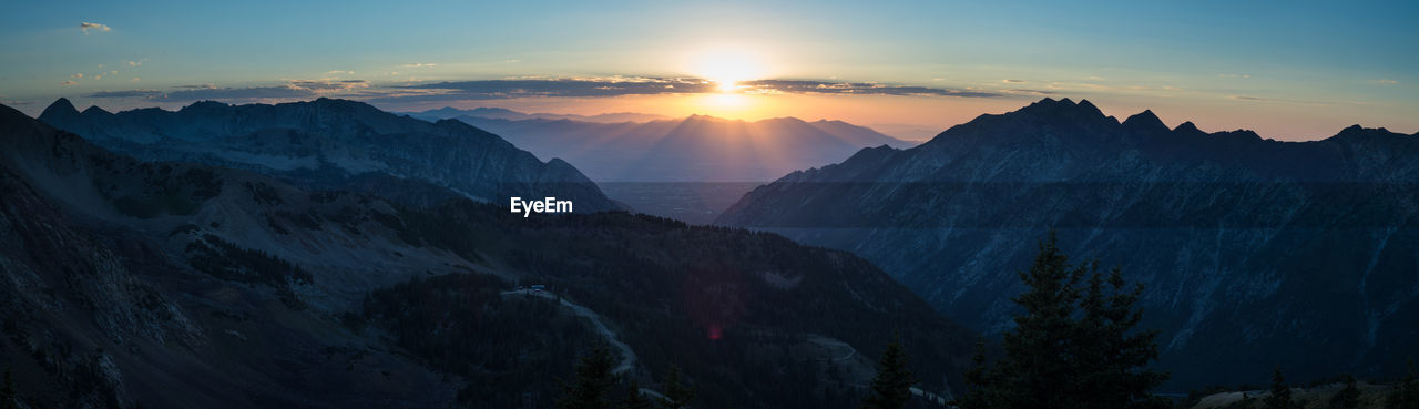 Scenic view of mountains against sky during sunset