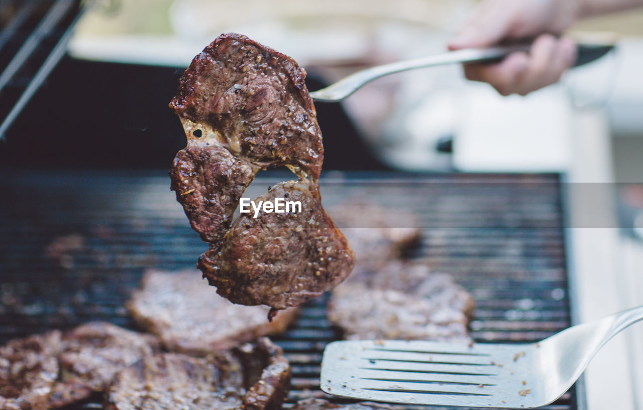 Close-up of meat on barbecue grill