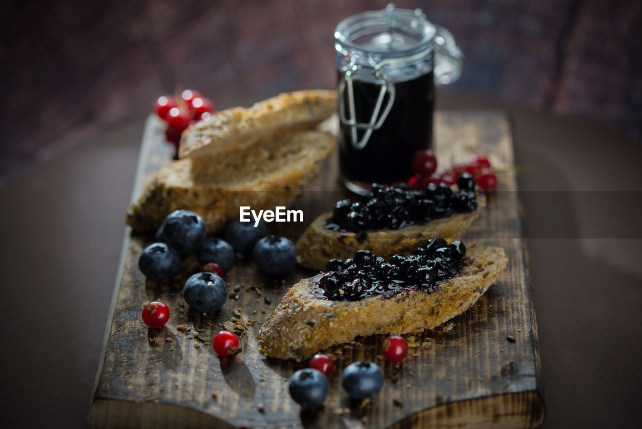 Breads with berry fruits on cutting board