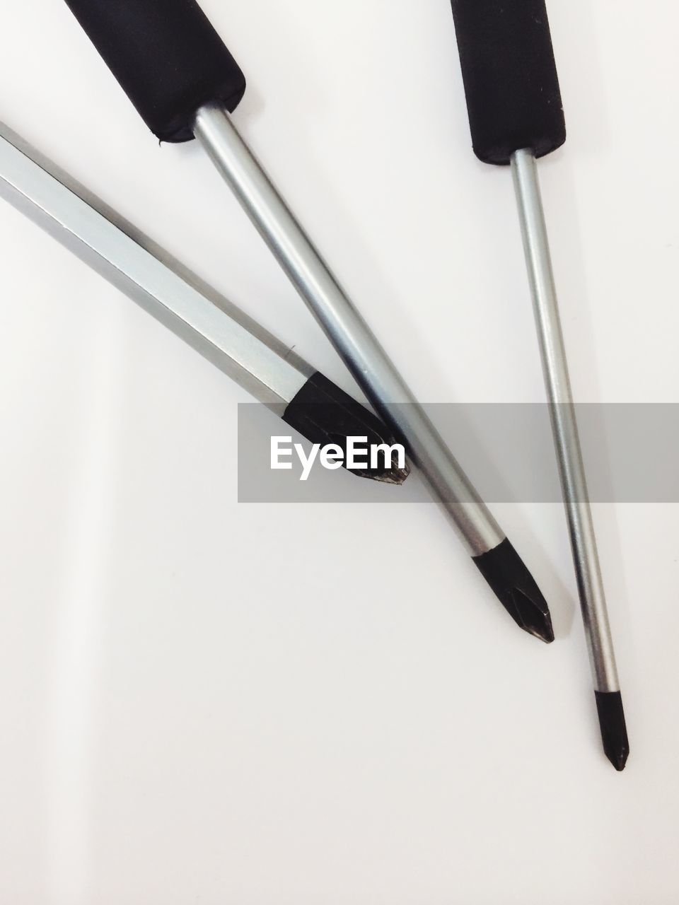 Cropped image of various screwdrivers against white background