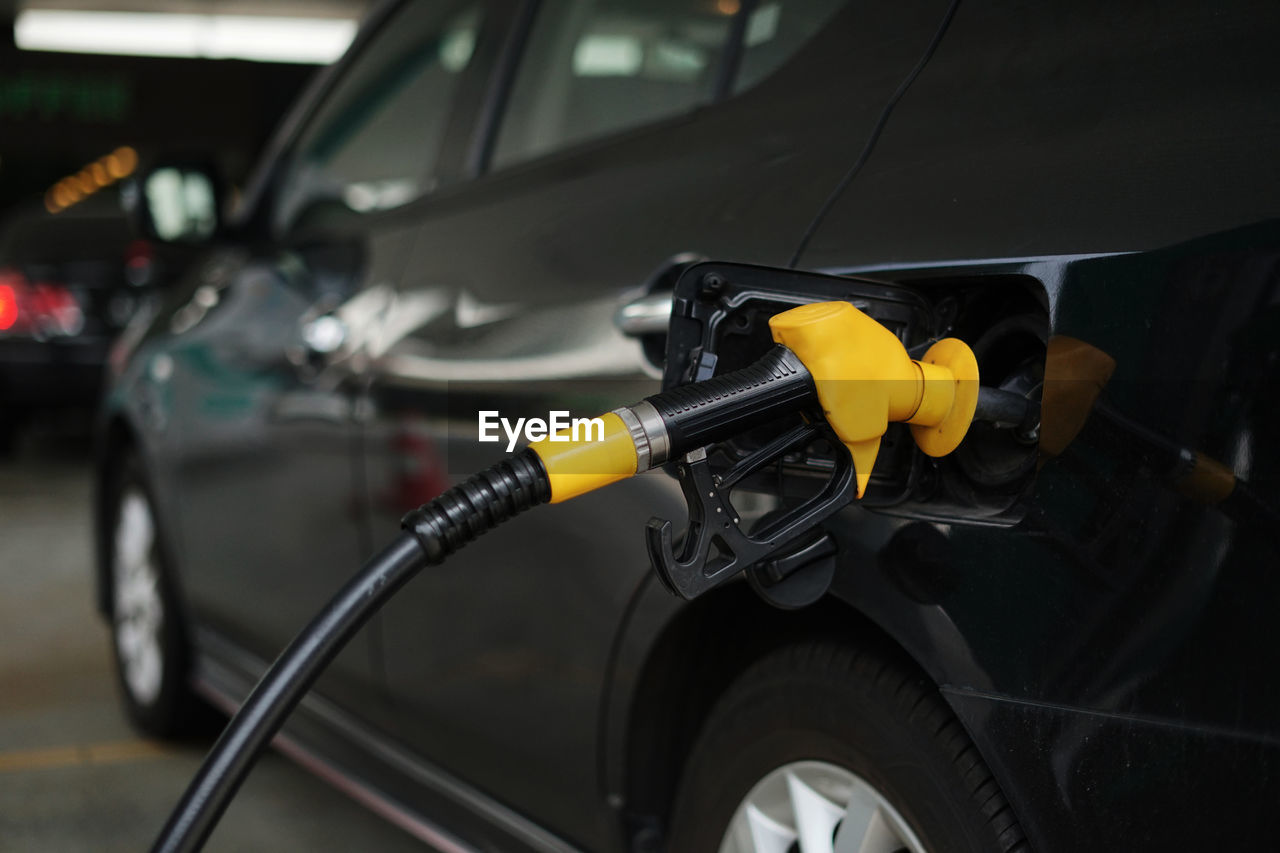 Close-up of fuel pump in black car