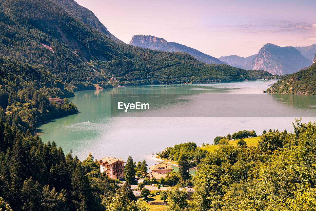 Scenic view of lake and mountains against sky