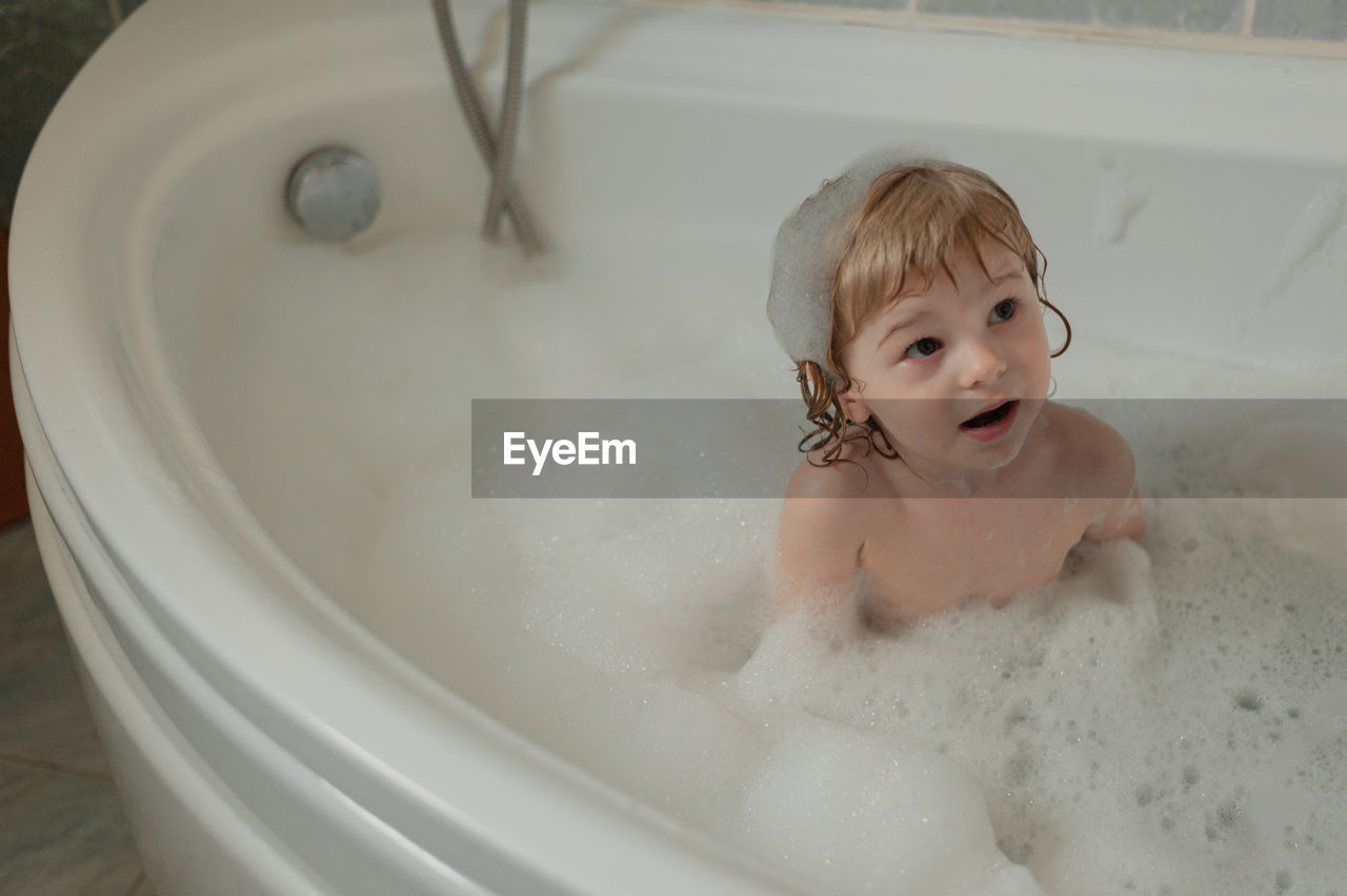 Portrait of boy in bathroom at home