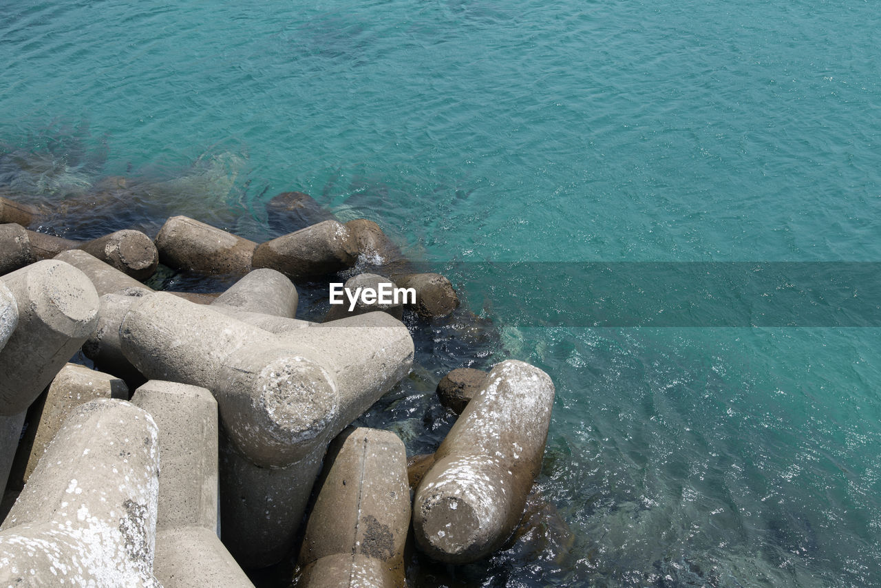 High angle view of tetrapods by sea