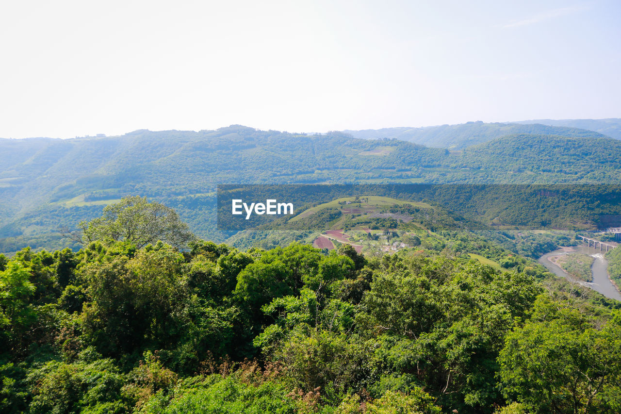 Scenic view of tree mountains against sky