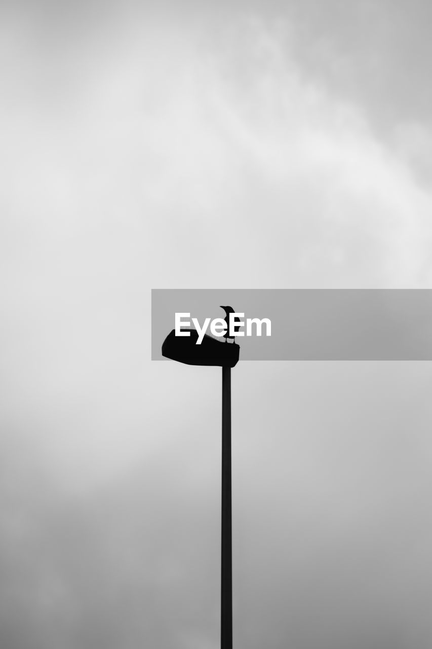 street light, sky, cloud, lighting equipment, low angle view, street, no people, overcast, light fixture, black and white, lighting, nature, light, monochrome, pole, outdoors, day, silhouette, copy space, black, monochrome photography, line, floodlight, white, wind