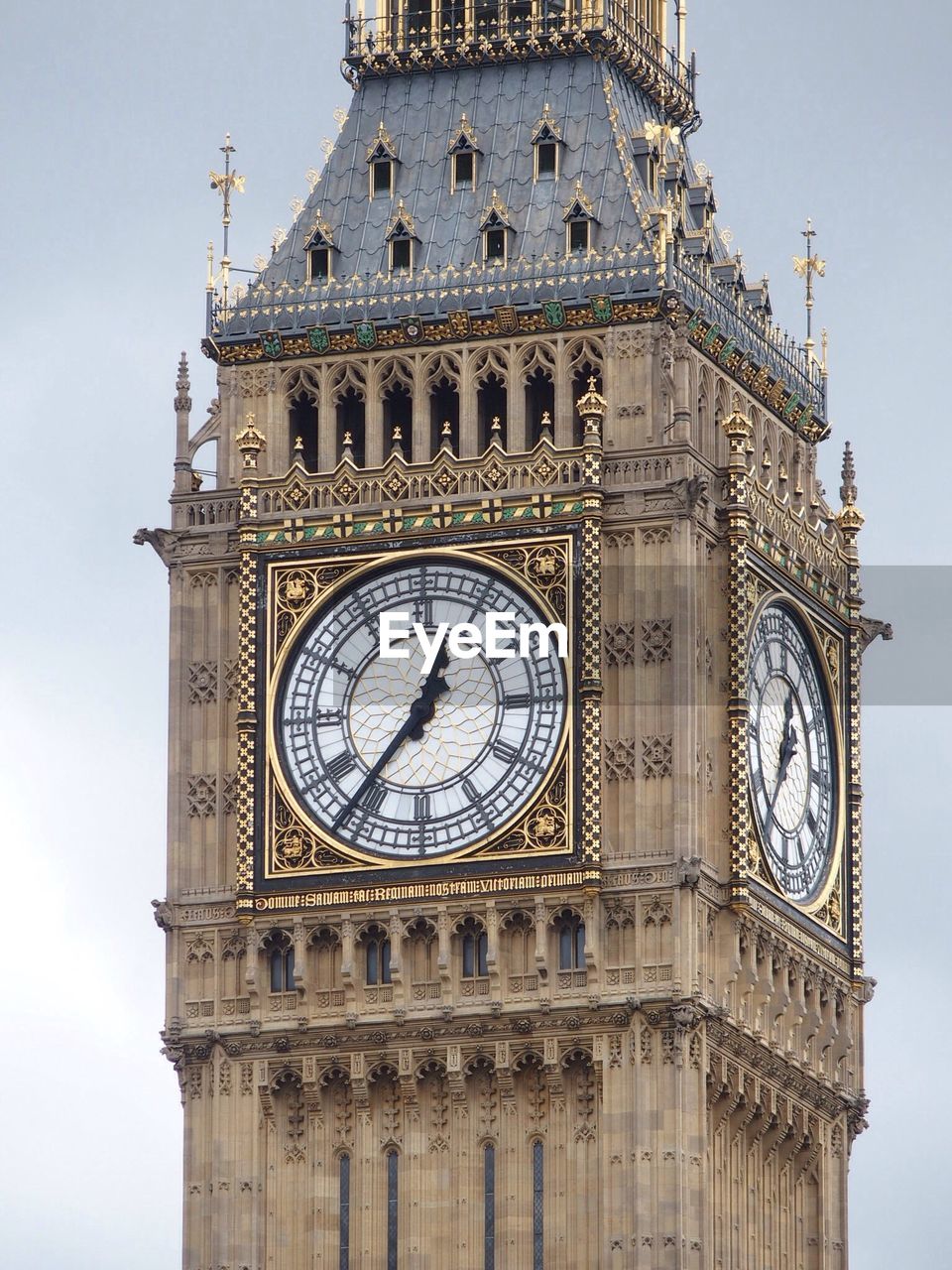 CLOSE-UP OF CLOCK TOWER AGAINST SKY